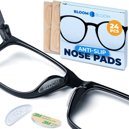Close-up of transparent silicone nose pad with soft curved shape and matte surface texture designed to blend into eyeglass nose bridge